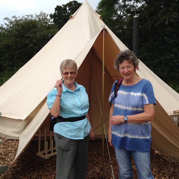 6. Jane - Merrill outside a tent.jpg